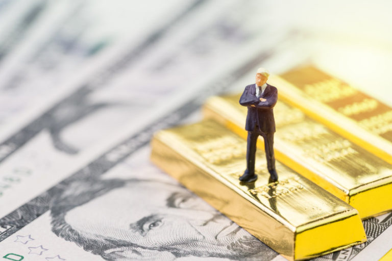 US dollar and gold bars | US dollar