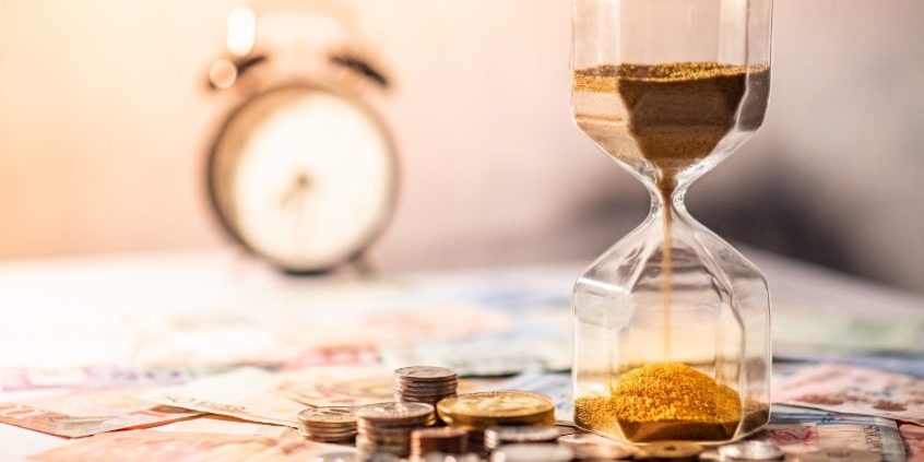 hourglass and money | the fed is doing its job