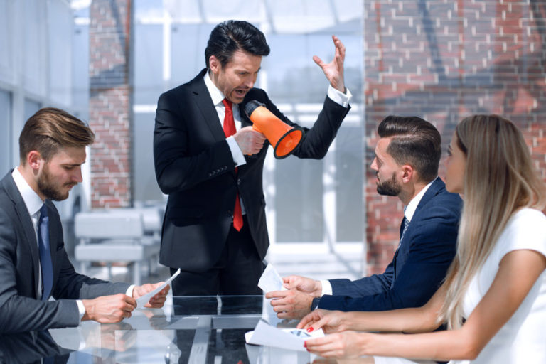 ignore the market doomsayers | businessman talking through a megaphone