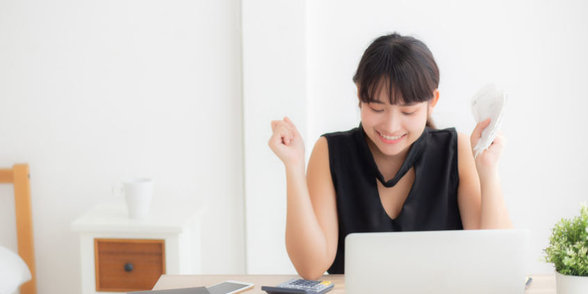 Beautiful young asian woman calculating finance household and wr why stock prices move | trader counting money