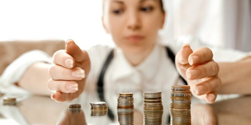 woman protecting money | how to protect your portfolio against a stock market crash