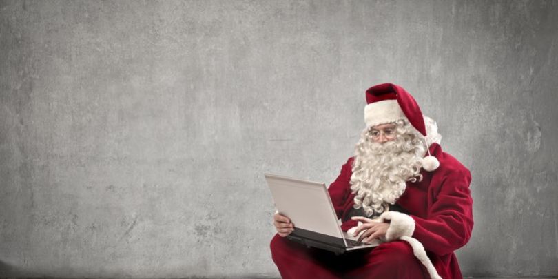 16621145 – santa claus using a laptop computer holiday trading tips