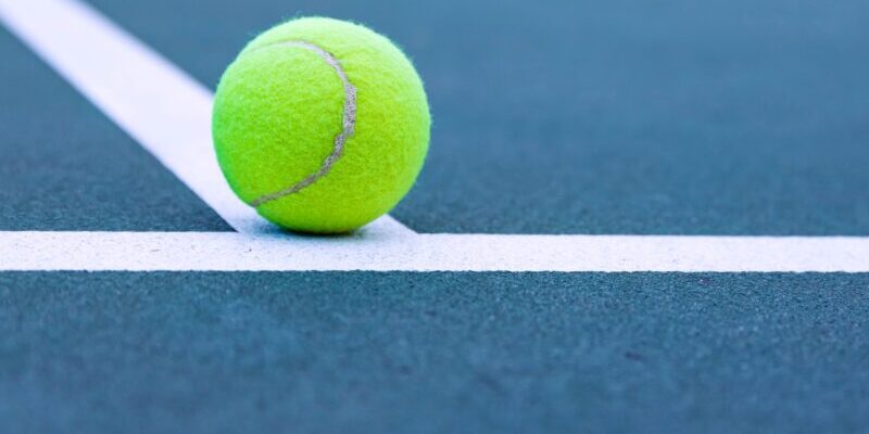 tennis ball on court line | accepting losing trades