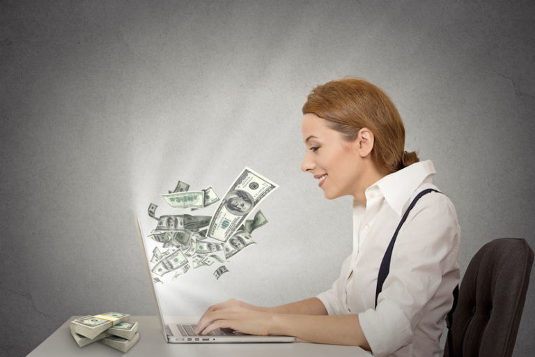 smiling trader with money | options trading tips