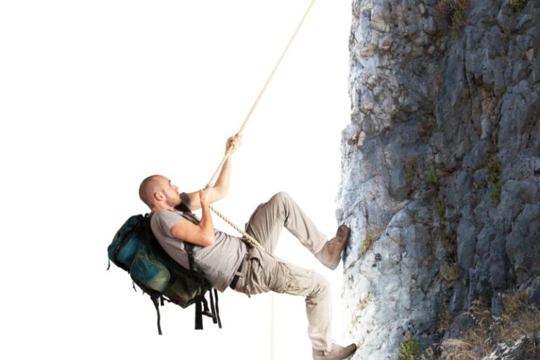 man climbing a mountain| wall of worry