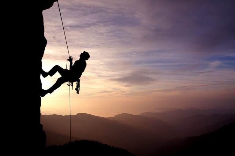 rock climber looking up vertical wall | sentiment