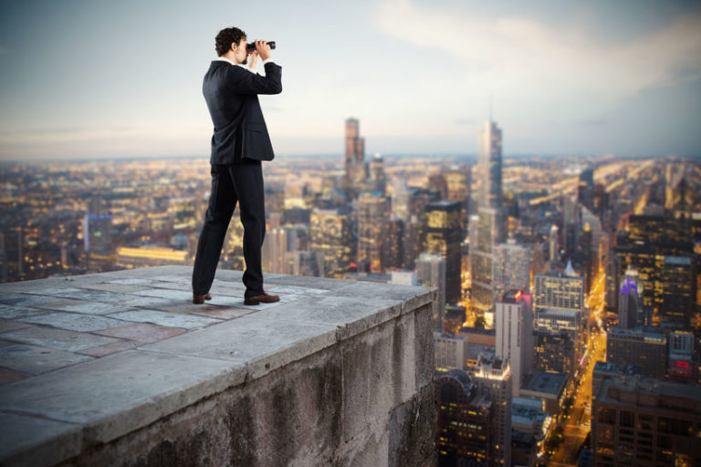 businessman with binoculars | stock market halftime report