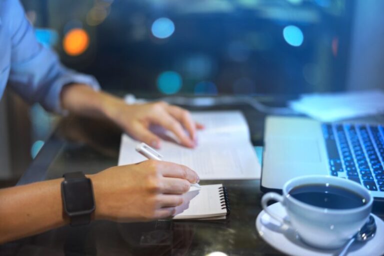 young trader taking notes | improve your trading performance