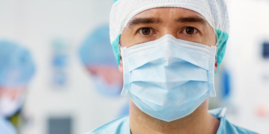 coronavirus pandemic | doctor in surgical mask