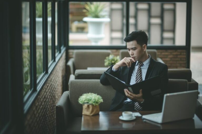 young trader patiently reading | volatile marketing conditions