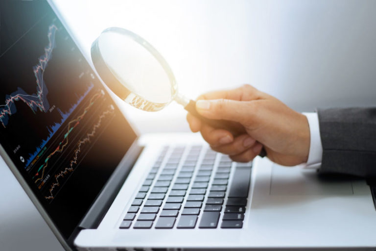 How to find trades | magnifying glass with stock chart