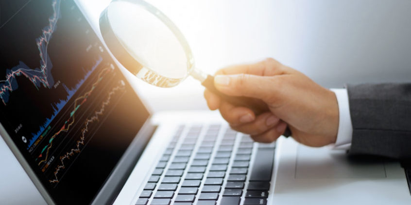 How to find trades | magnifying glass with stock chart