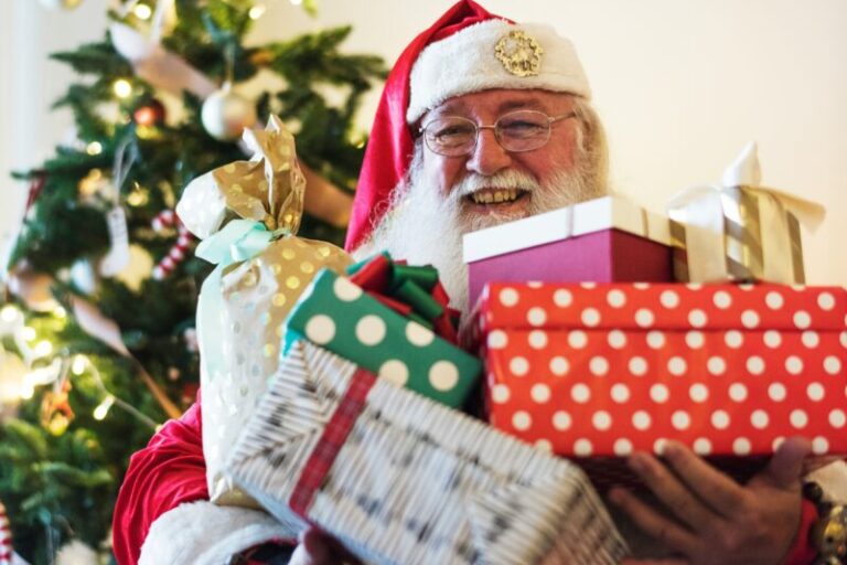 Santa Claus holding gifts | Santa Claus Rally in 2025