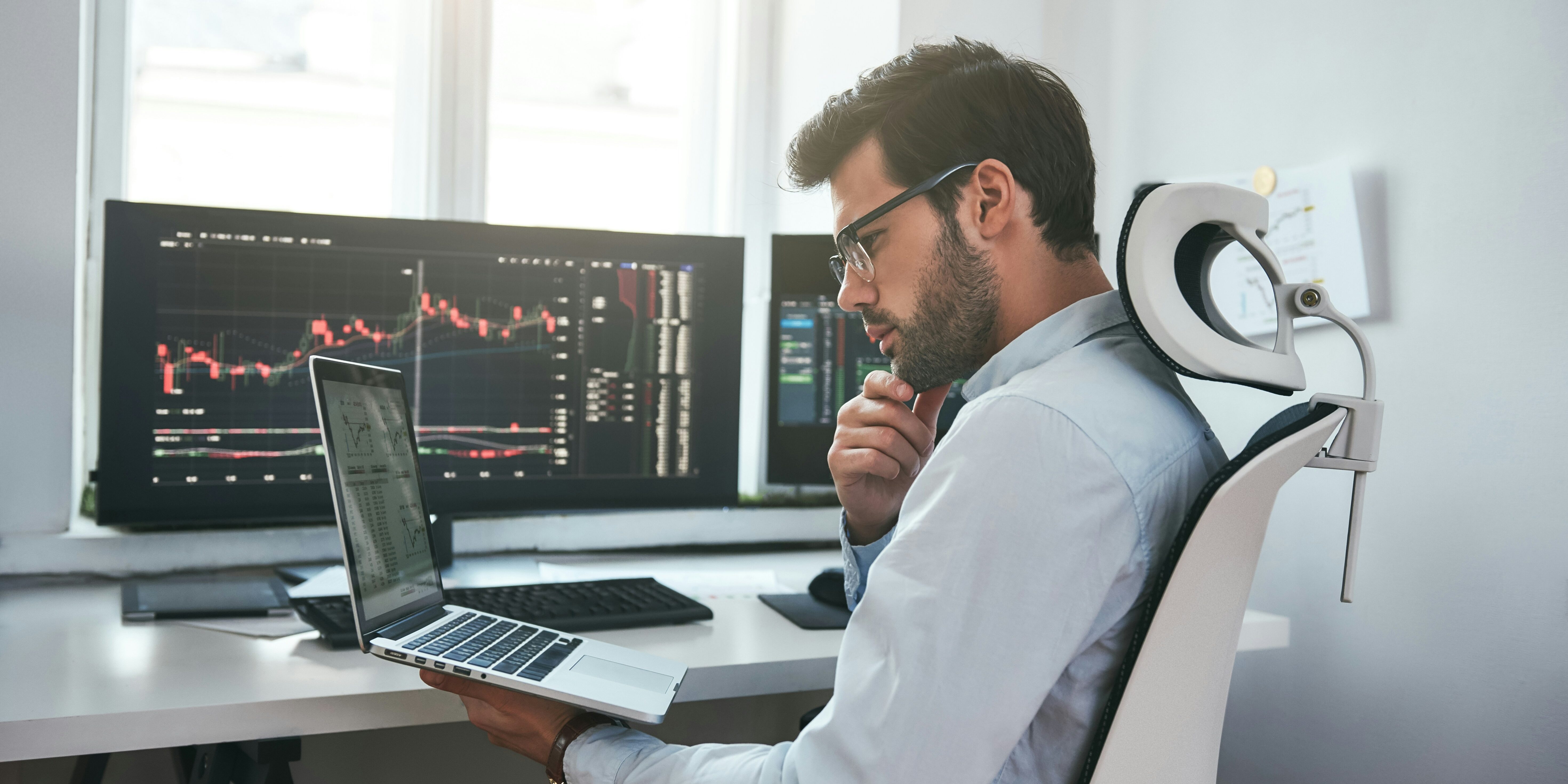 stock trader studying charts | bad trading advice