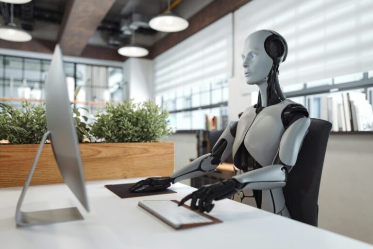 robot sitting at computer | ai trading models versus humans