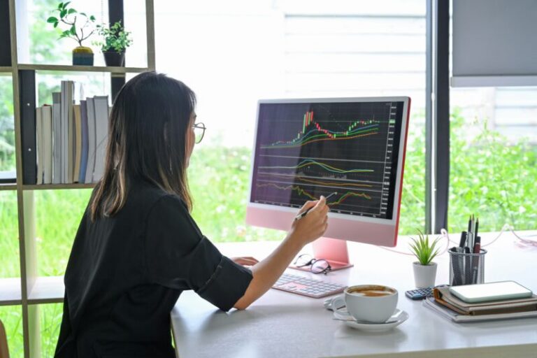 woman analyzing stock chart on monitor | stock market indicator