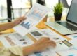 woman reviewing reports | manufacturing data reports