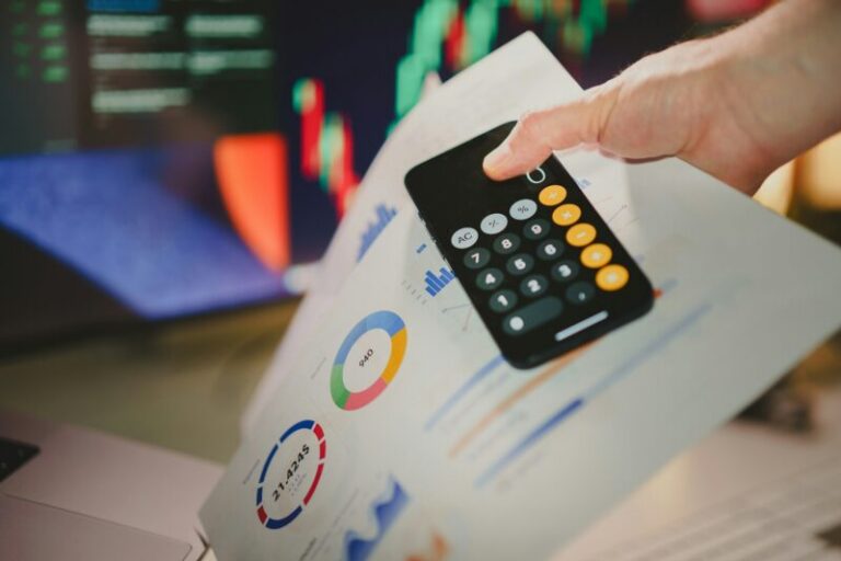 calculator, price charts, and stock charts on monitor | how to use earnings estimates