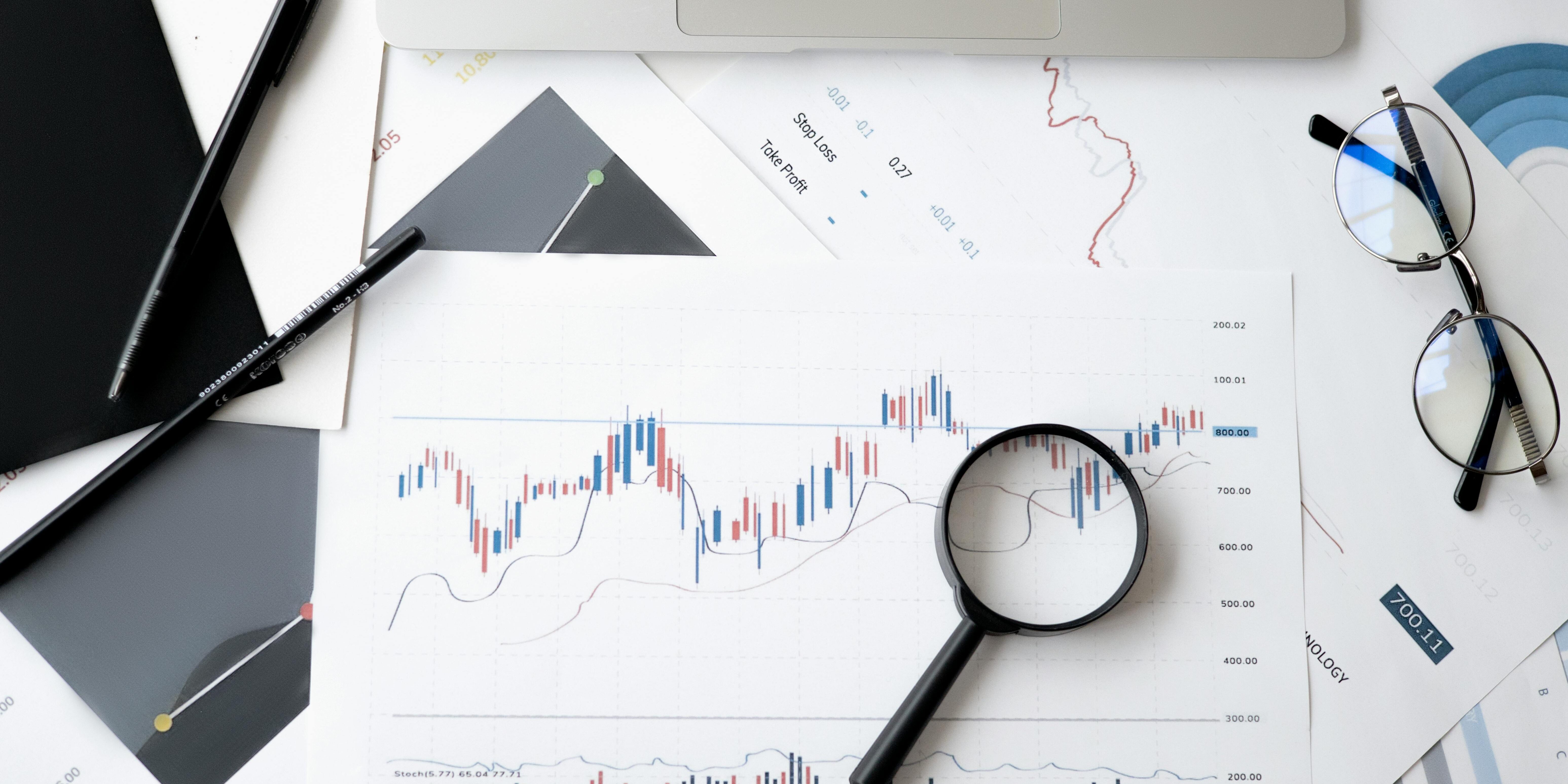 pexels-anna-nekrashevich-6801648 stock charts with magnifying glass | follow the market trend