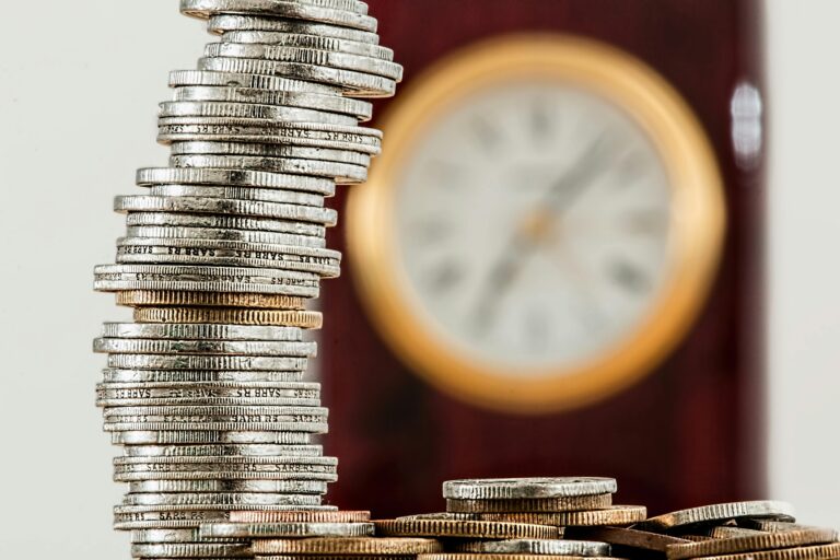 stack of coins with clock in background | invest in CEOs