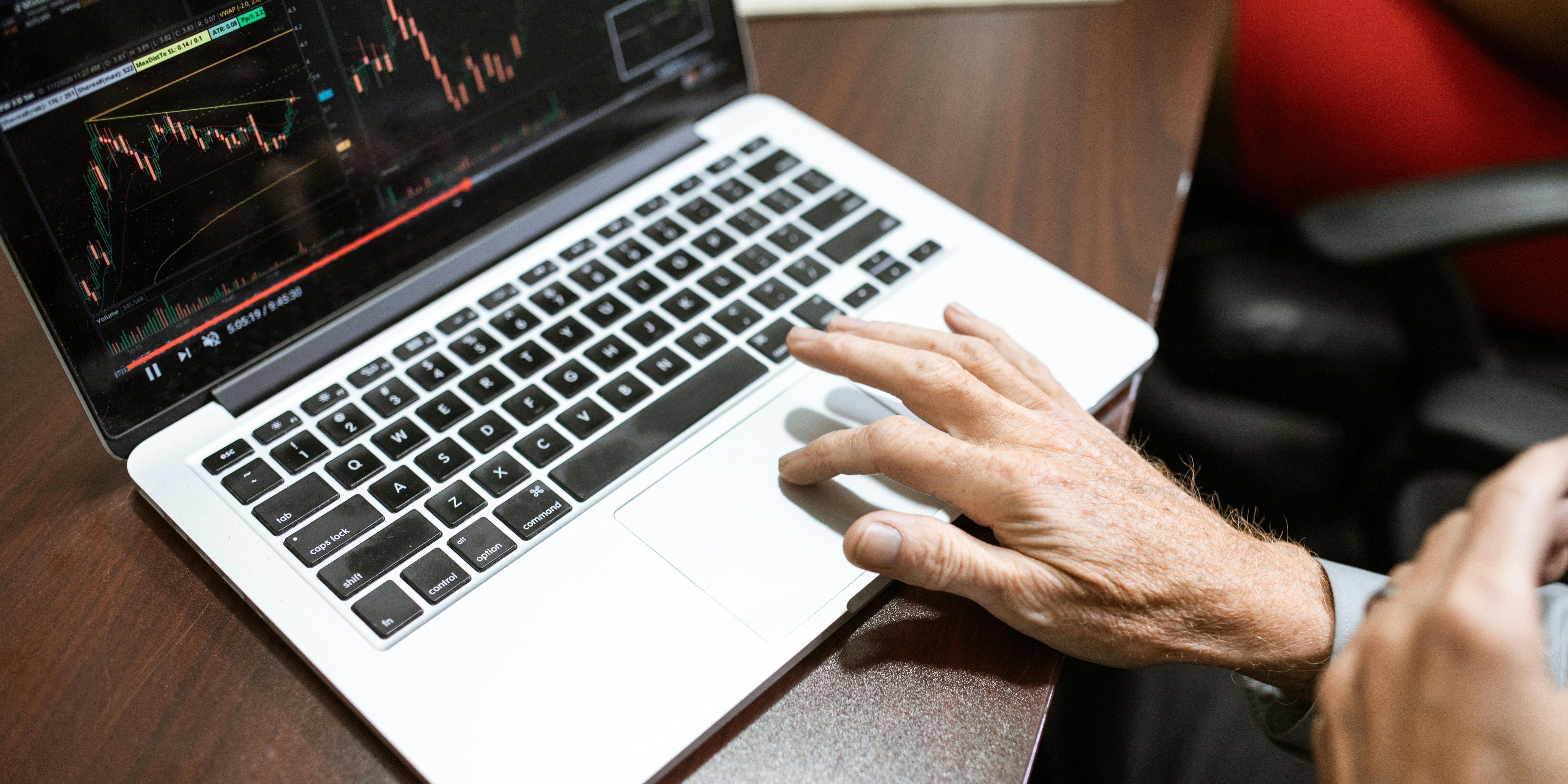 person trading on their laptop | active trading