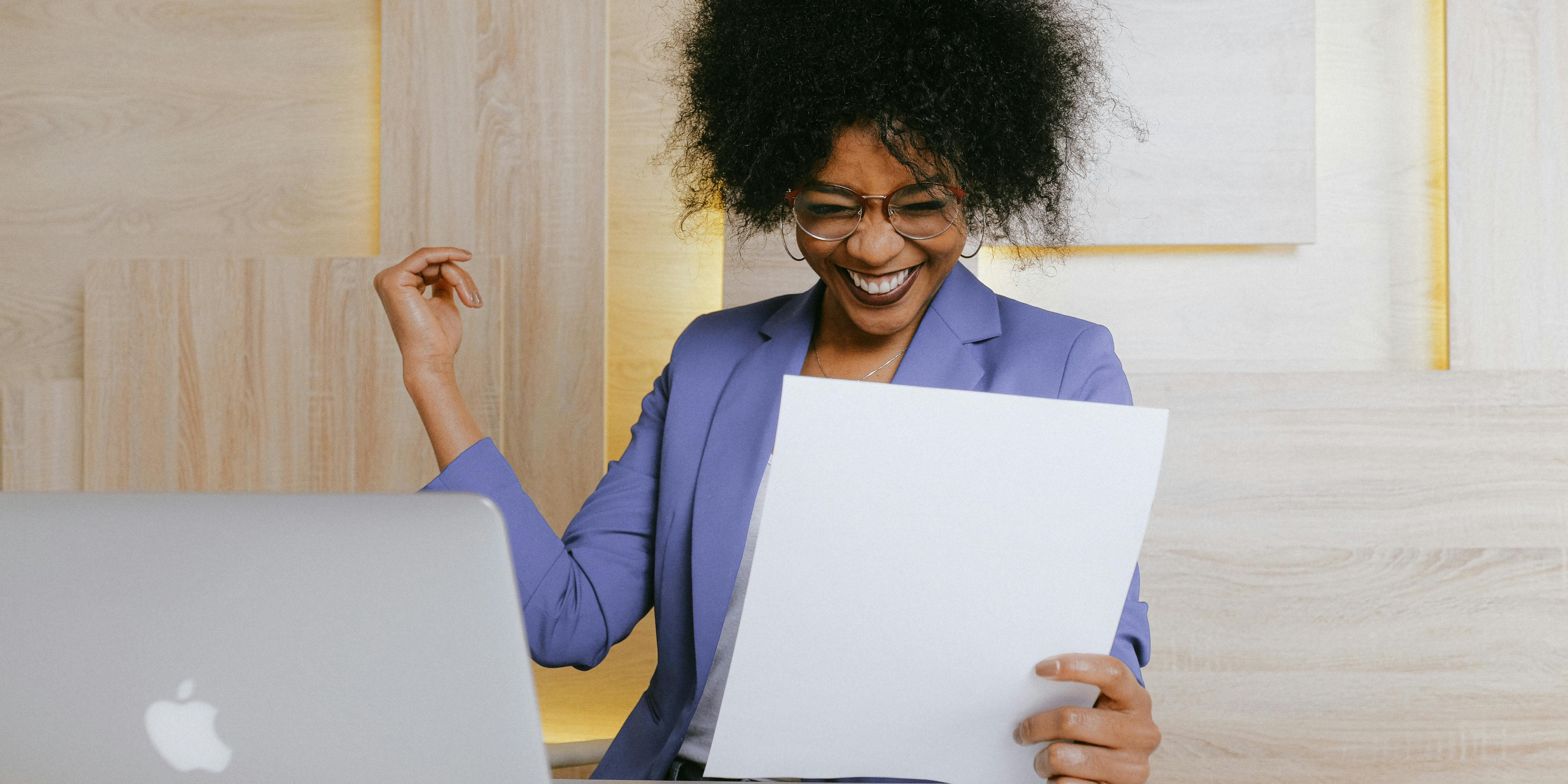 female trader celebrating a win | pullbacks when wall of worry is up