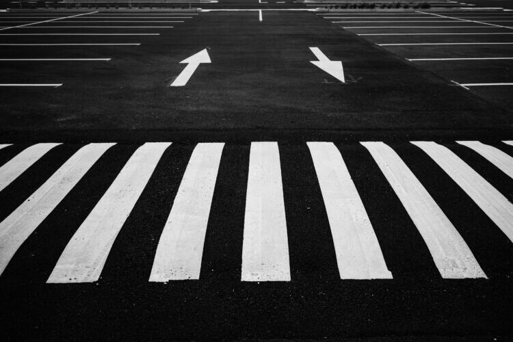 arrows and zebra stripes on pavement | market conditions and market signals