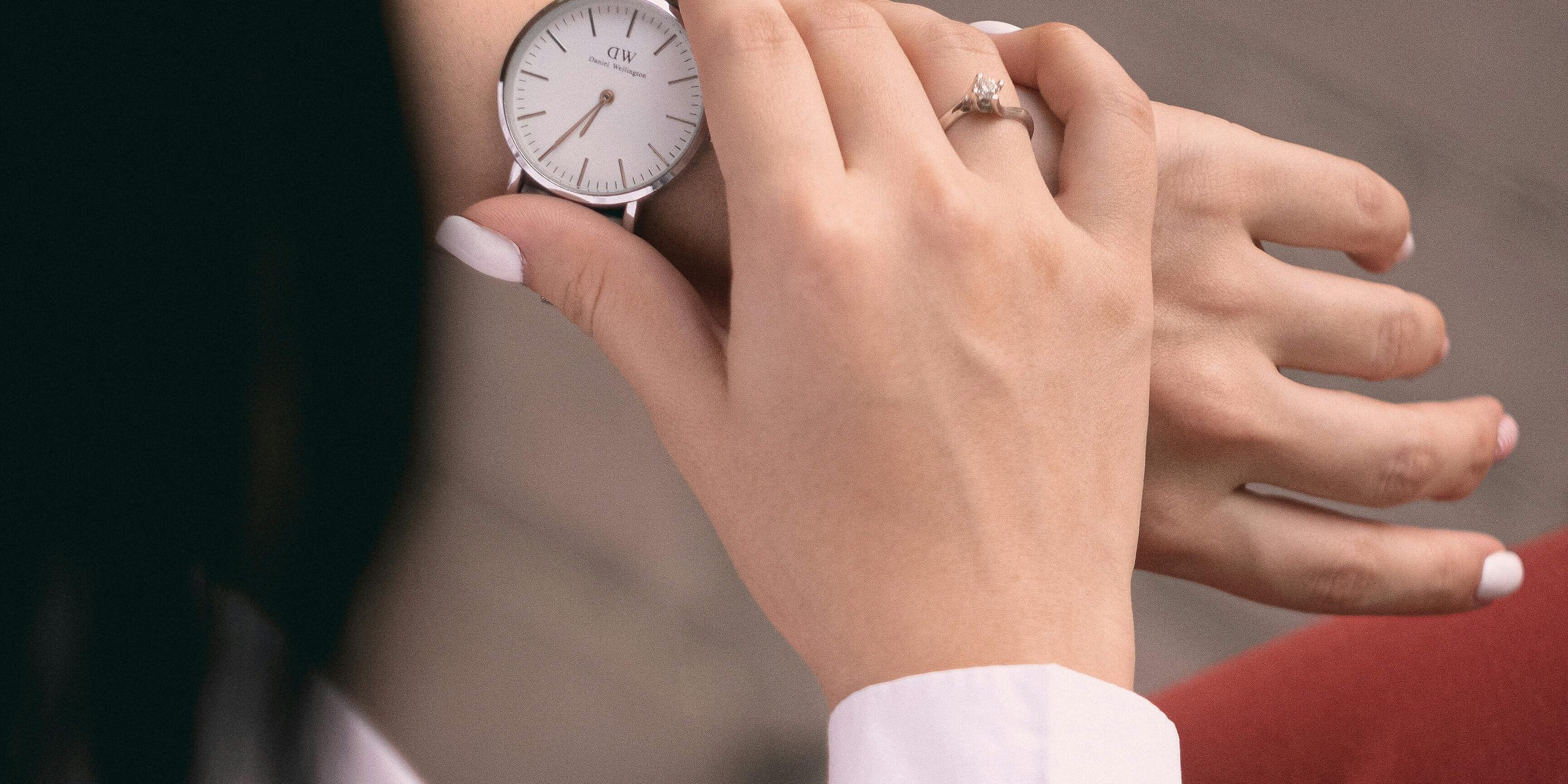woman checking her watch | high implied volatility