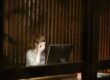 anxious woman sitting in front of computer | bull market anxiety