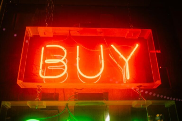 neon "buy" sign | buying the dip